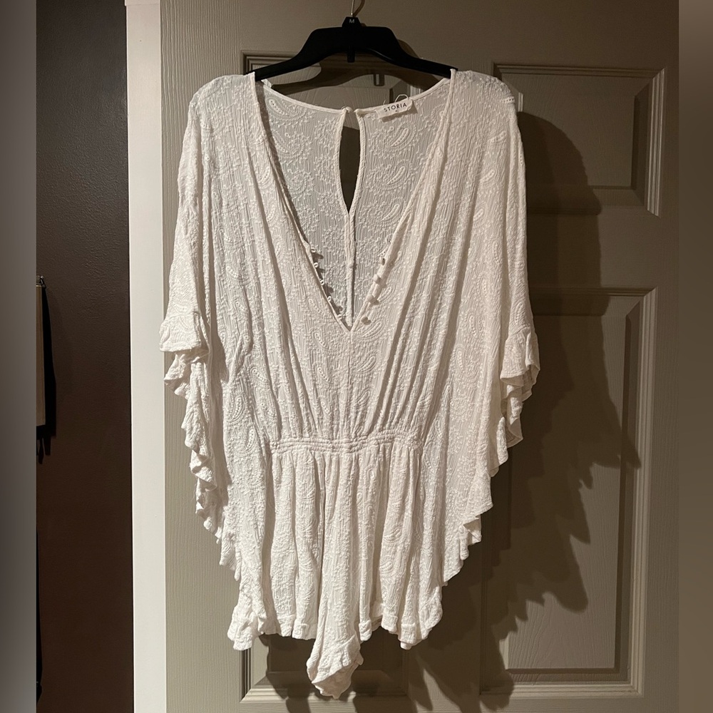 Storia romper. Size medium. Like new.